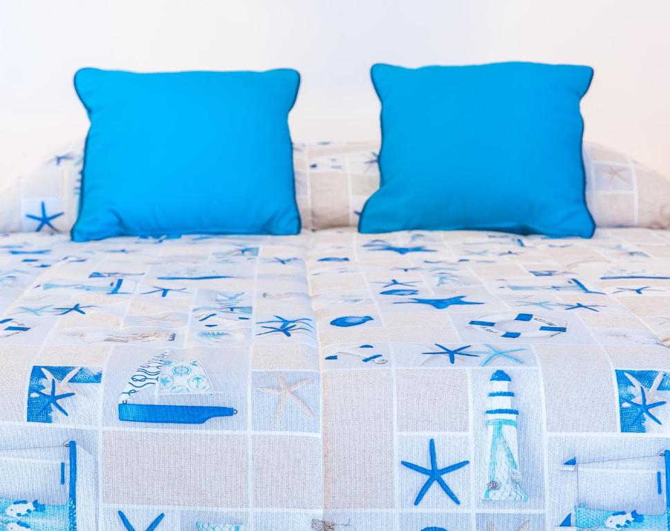Postel nebo postele na pokoji v ubytování Hotel Los Corales