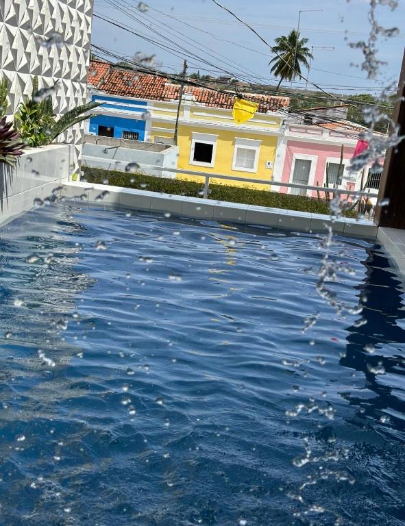a pool of water in front of a building at Pousada Berro do Bode in Cabaceiras