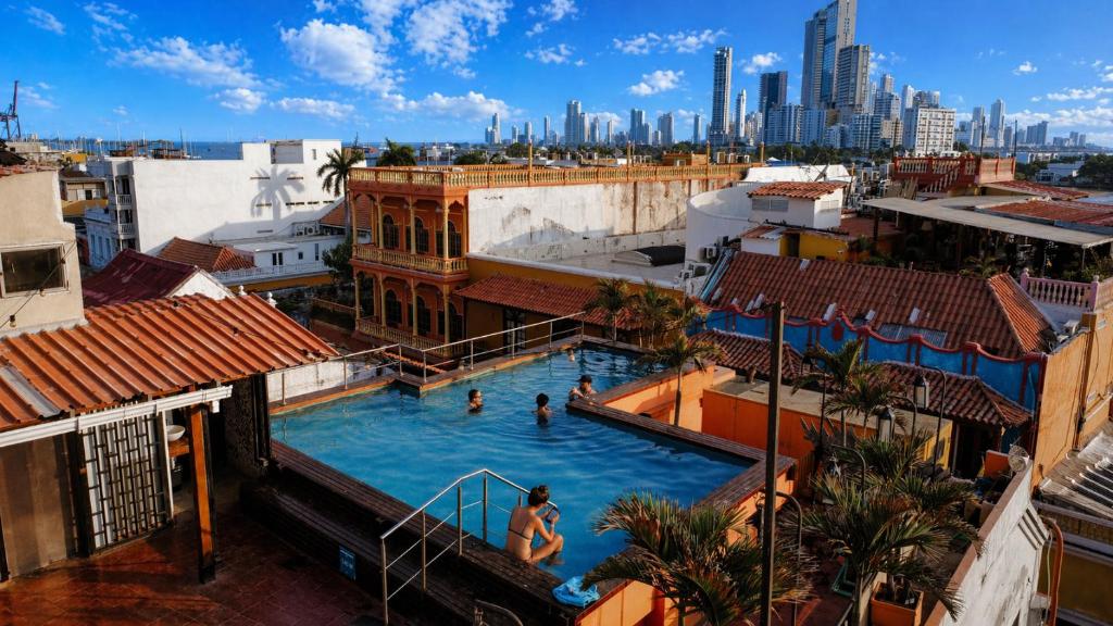 a view of a swimming pool with a city in the background at Kim in Cartagena de Indias