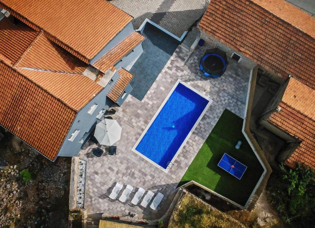 an overhead view of a backyard with a swimming pool at Villa DUKA with heated private pool, Makarska region in Petričevići