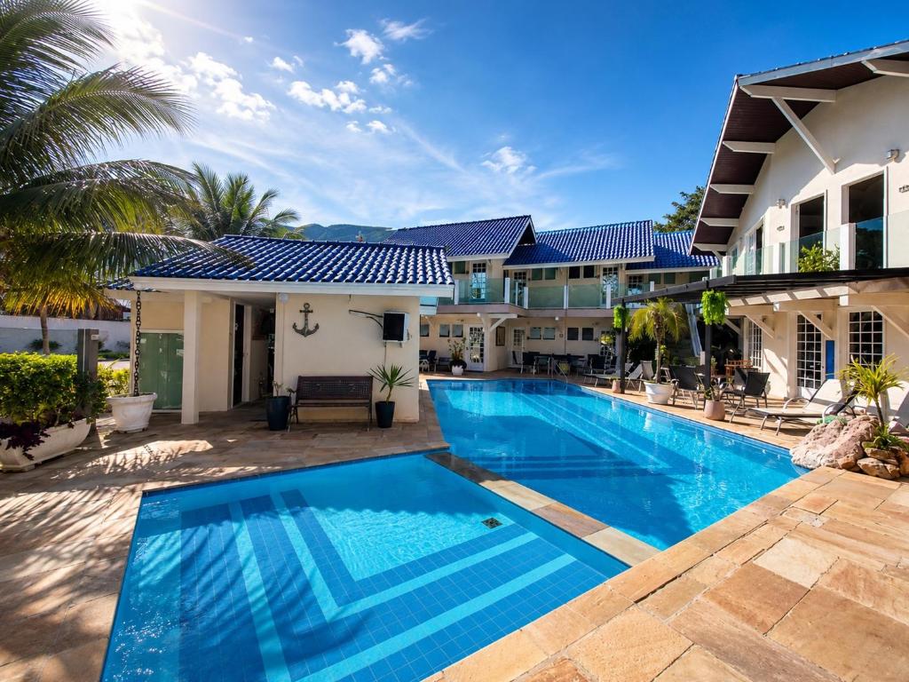 an image of a swimming pool in a villa at Paúba Beach Hotel in Pauba
