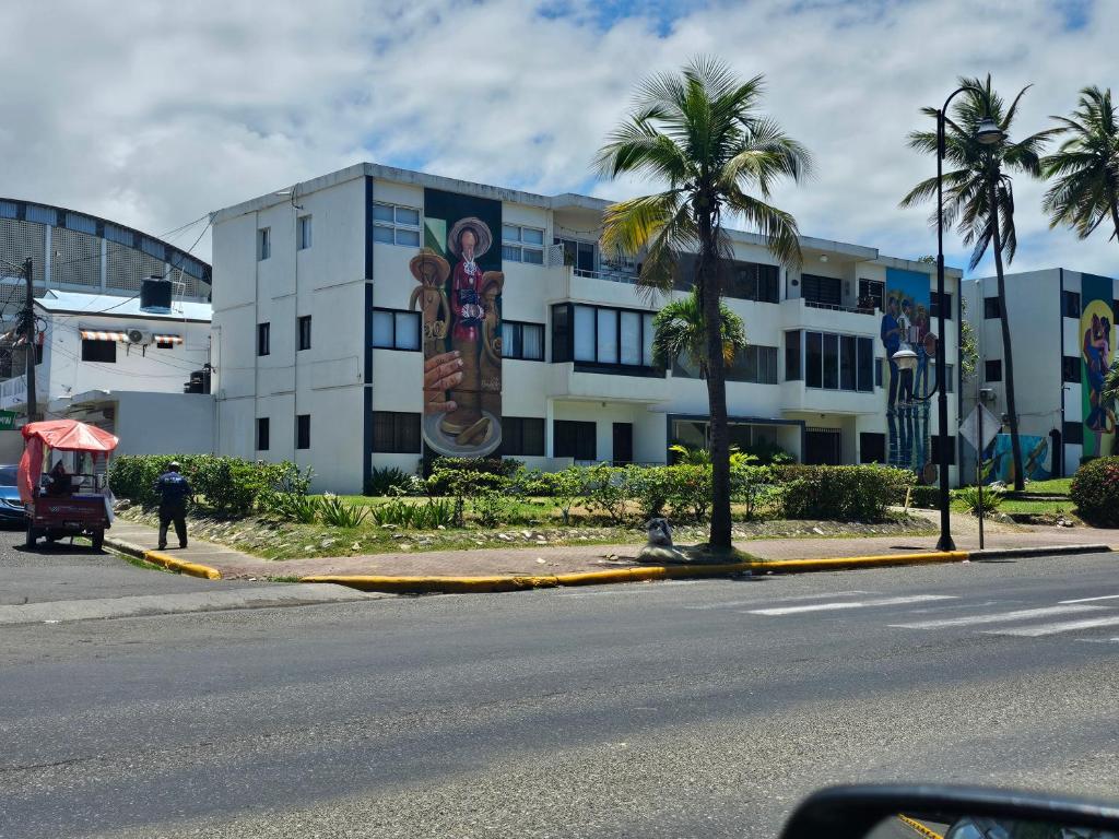 a building with a large mural on the side of it at AZUL PUERTO Del MALECON in San Felipe de Puerto Plata