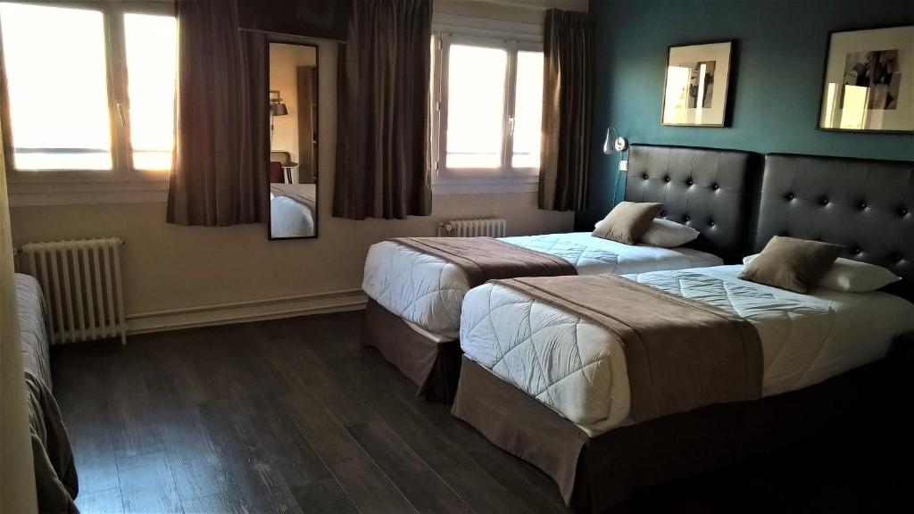 Postel nebo postele na pokoji v ubytování Hotel Des Cedres