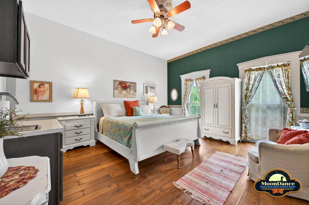 a bedroom with a bed and a ceiling fan at Nashville Suite 1 in Nashville