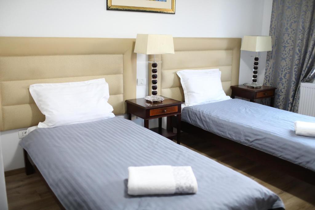 Postel nebo postele na pokoji v ubytování Hotel EKA