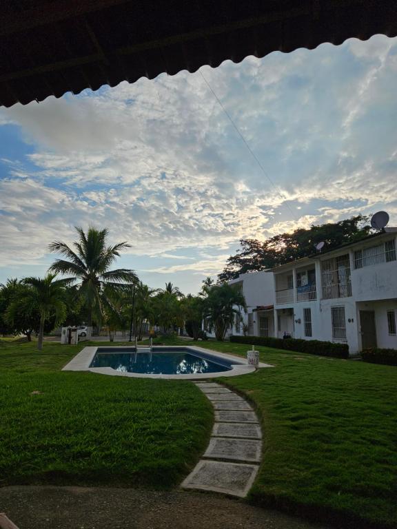 a kite flying in the sky over a yard at Casa Amarilla in Barrio Nuevo
