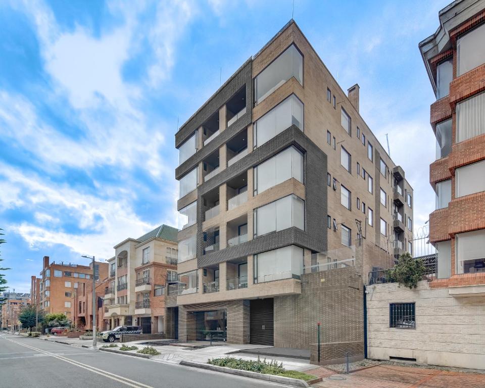 an apartment building on the corner of a street at Hotel EspacioYa By Mario Rental 103 in Bogotá