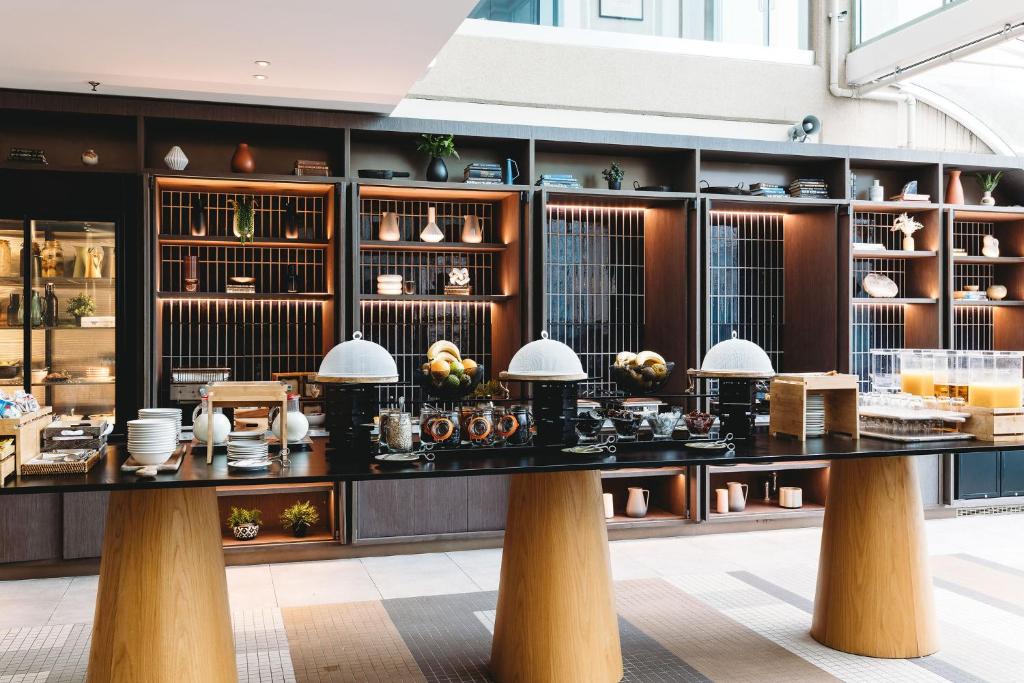a store with a large table in a room at Rydges Canberra in Canberra