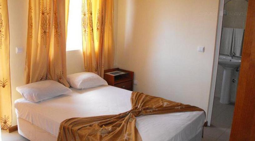 Postel nebo postele na pokoji v ubytování Hotel Lazareto