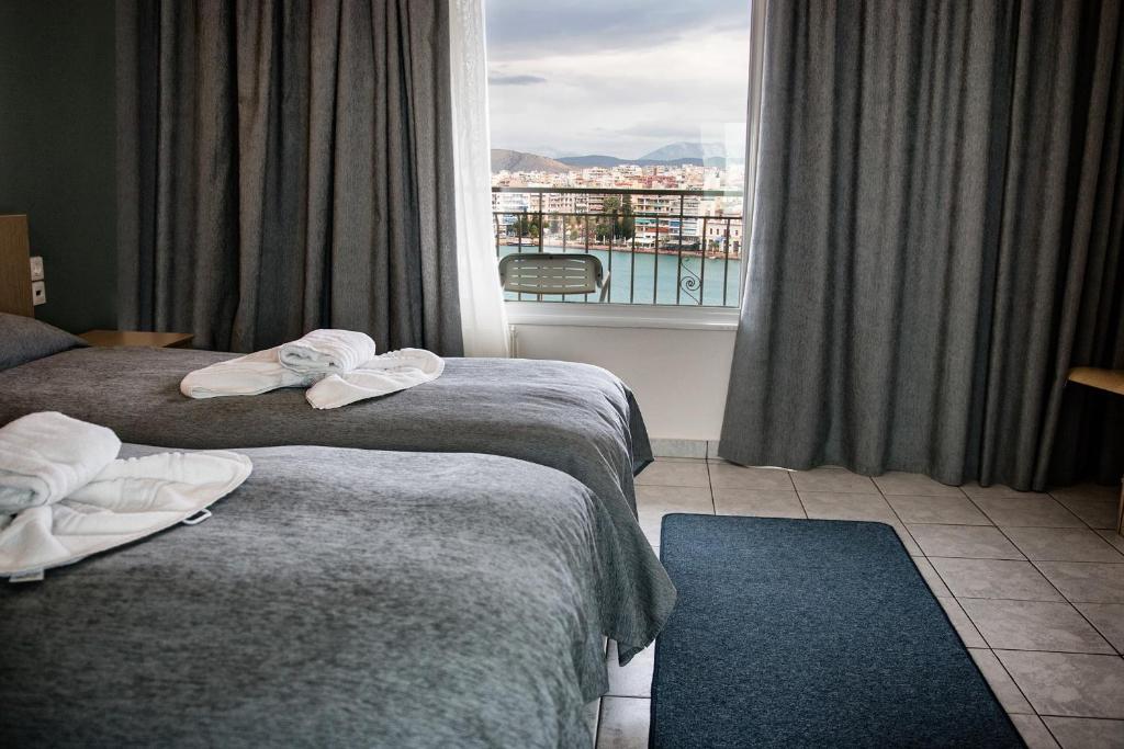 Postel nebo postele na pokoji v ubytování Hara Hotel