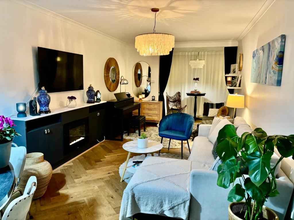 a living room with a couch and a fireplace at Beautiful Brighton in Melbourne