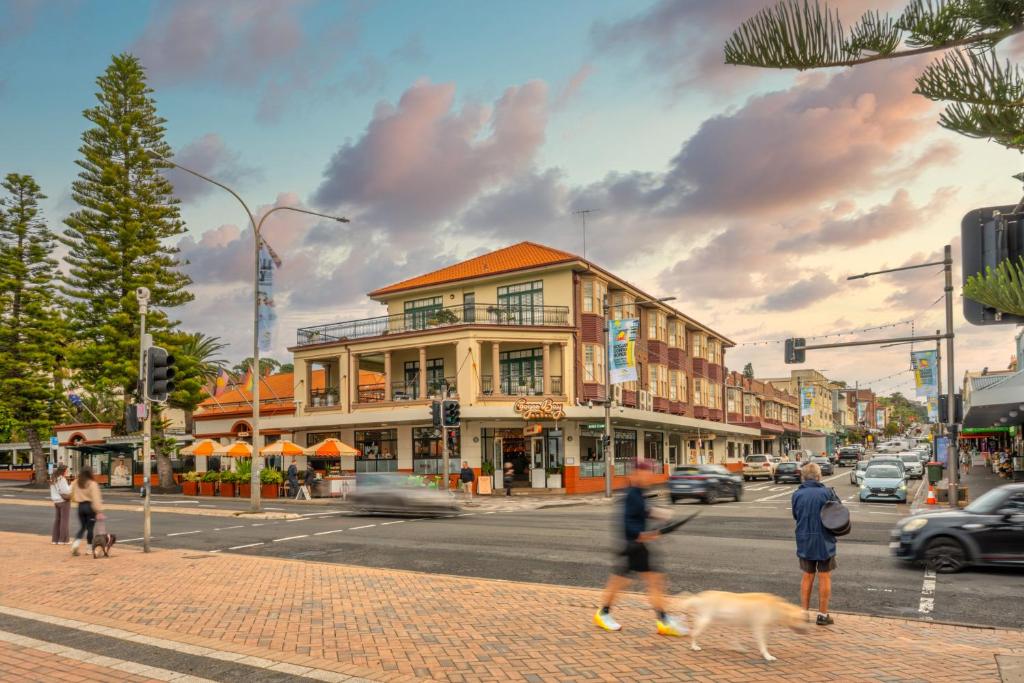 a rendering of a city street with people and dogs at Coogee Bay Hotel in Sydney