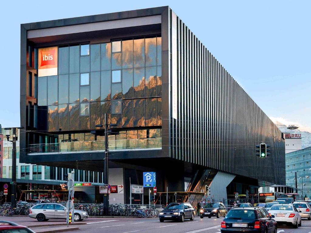 a building with a lot of windows on a city street at ibis Innsbruck in Innsbruck