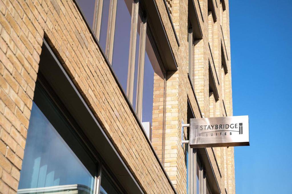 a sign on the side of a brick building at Staybridge Suites Brighton by IHG in Brighton & Hove