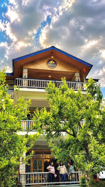 a group of people standing outside of a building at Enroot Manali in Vashisht