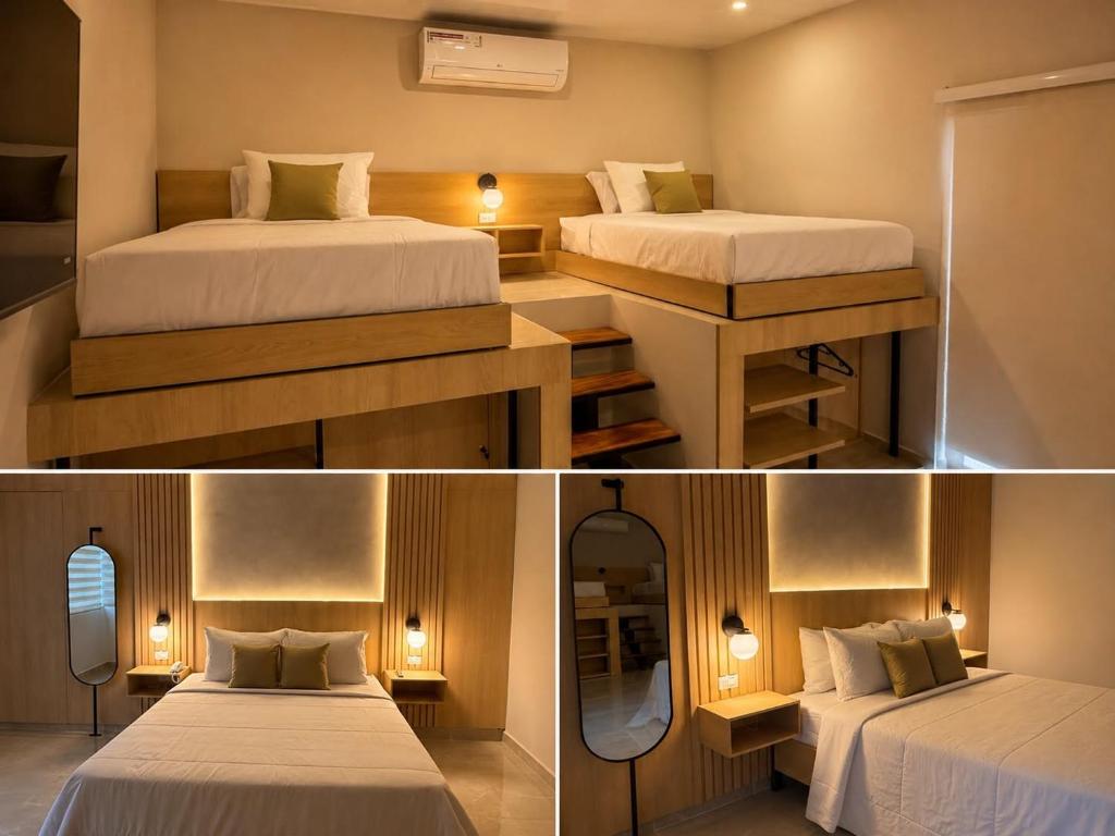 two beds in a small room with a mirror at Cumaé Hotel Boutique in Quimbaya