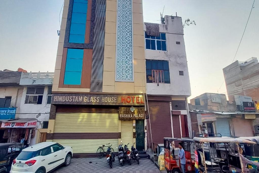 a building with a store in front of a street at Hotel Rashika Palace Near Sindhi Camp Bus Stand, Jaipur in Jaipur