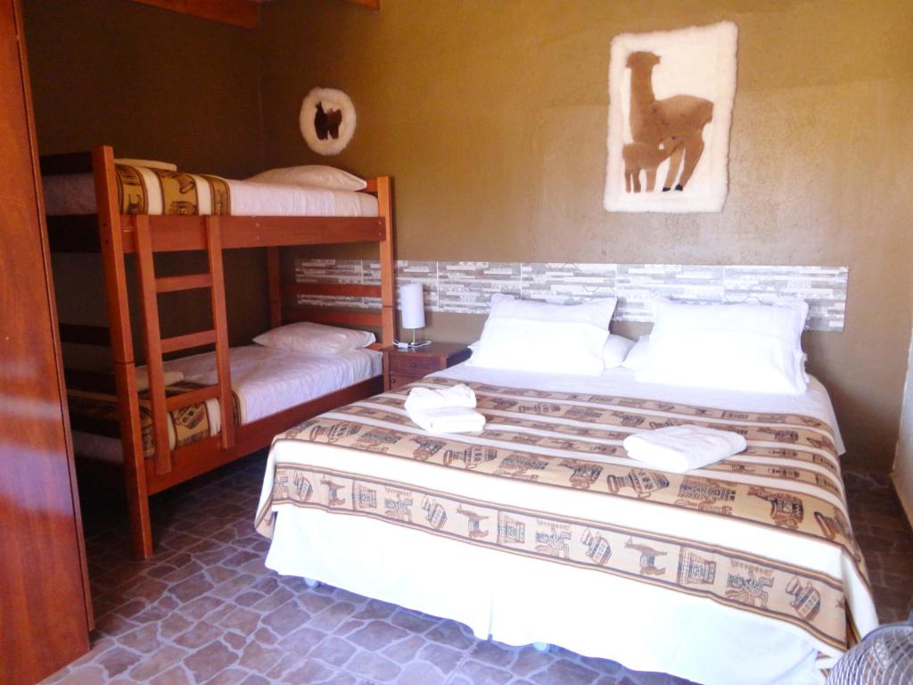 Postel nebo postele na pokoji v ubytování Hostal Pablito