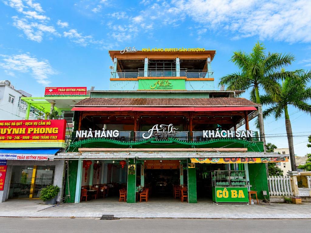 a building on a street corner with at Palette Anh Vu Hotel Phu Quoc in Phú Quốc
