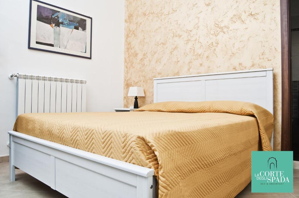 Postel nebo postele na pokoji v ubytování La Corte degli Spada - Borgo Antico del Salento