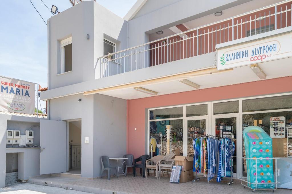 a building with a store with snowboards in the window at Nirvana Homes in Vlachata