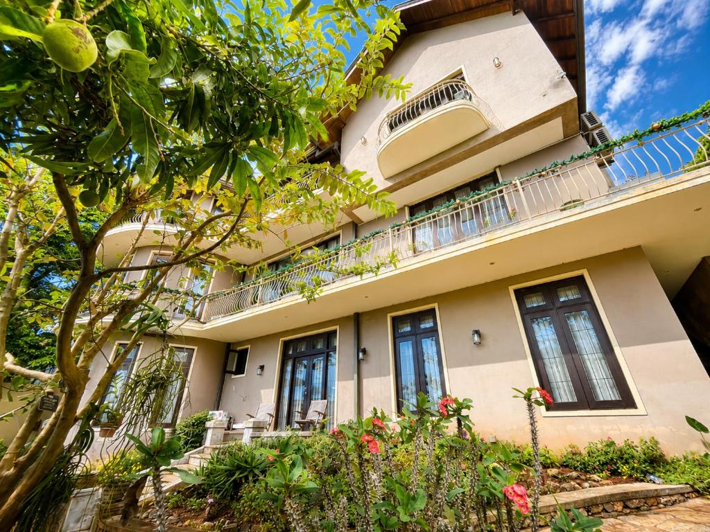 an apartment building with balconies and plants at The Manor Hanthana in Kandy