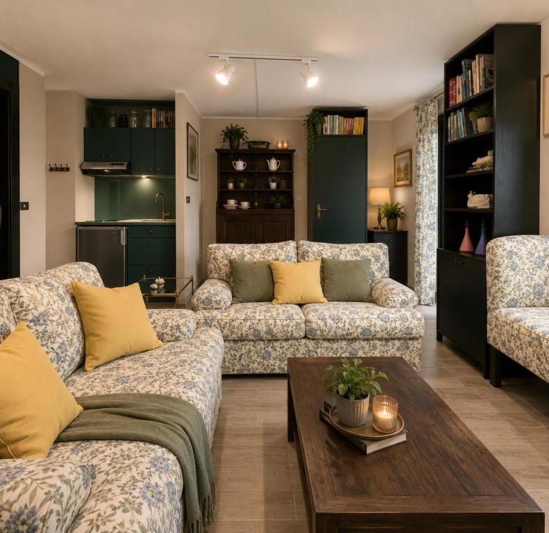 a living room with two couches and a coffee table at ComeCasa La Magdeleine 2BDR APT in La Magdeleine