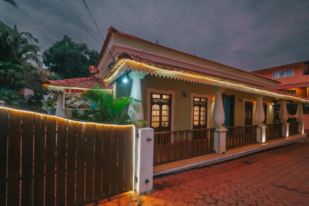 a house with a fence in front of it at La casa Verde 4BHK with Private Pool, Baga in Baga
