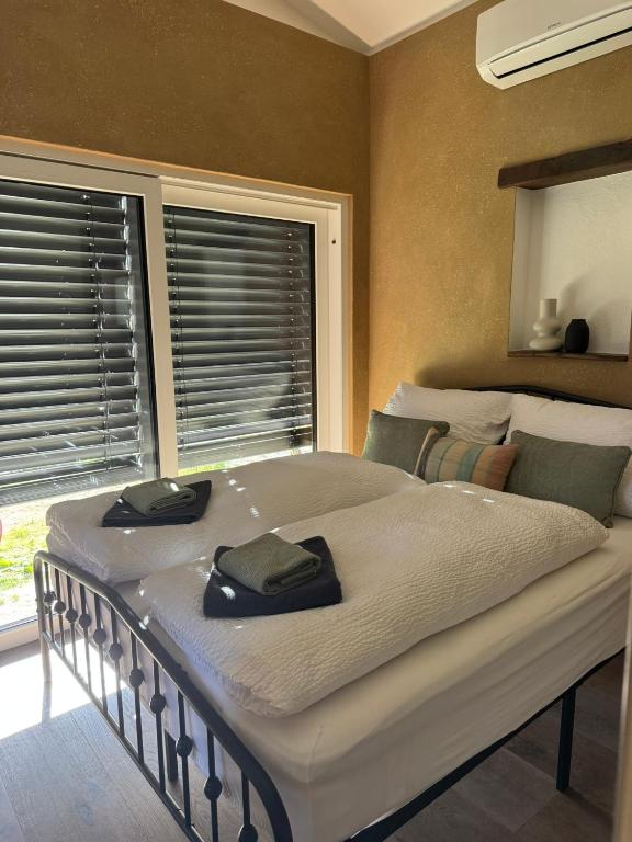 a large bed with two towels on it in a bedroom at Alte Schmiede in Sundern