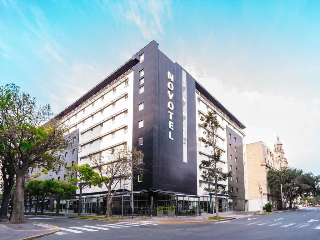 a building with a sign on the side of it at Novotel Lima San Isidro in Lima