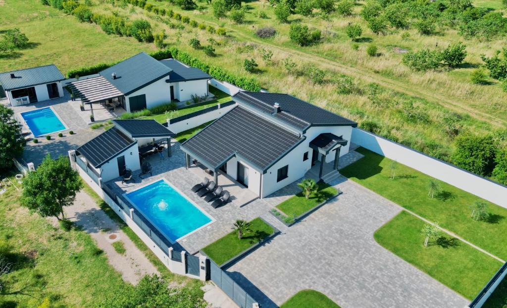 an aerial view of a house with a swimming pool at Luxury Villa Domino with Heated Pool in Mostar
