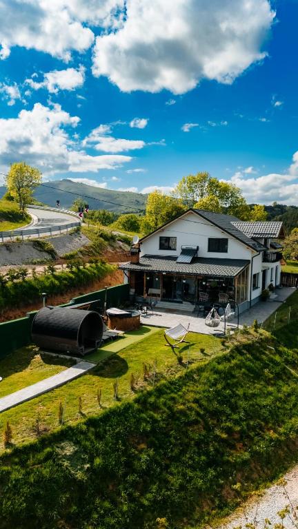 an aerial view of a house with a tanker at Cabana Brad Apuseni Villa in Cotorăşti