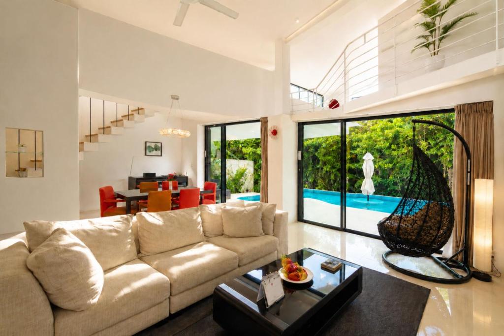 a living room with a couch and a table at The Seven Stars Resort in Ishigaki Island
