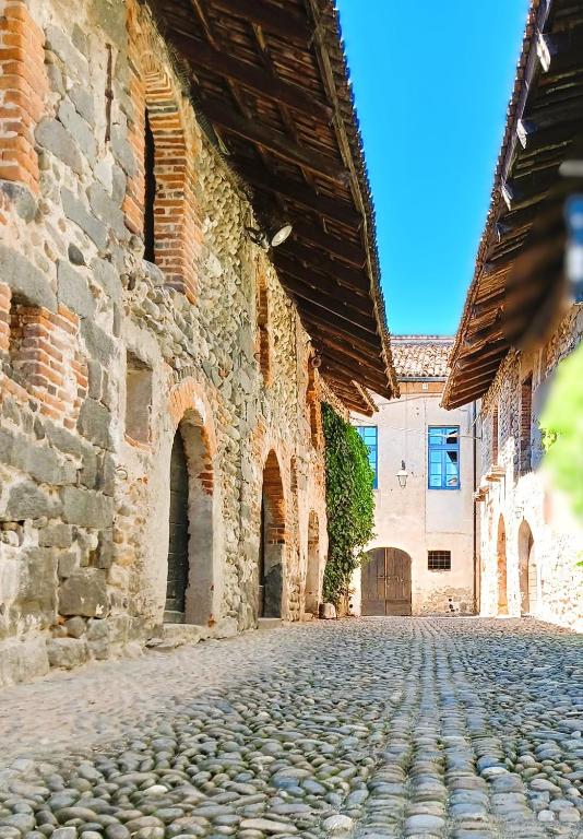 an empty street in an old stone building at La casetta in Candelo