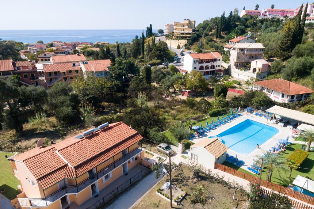 arial view of a villa with a swimming pool at Odysseus Apartments in Agios Gordios