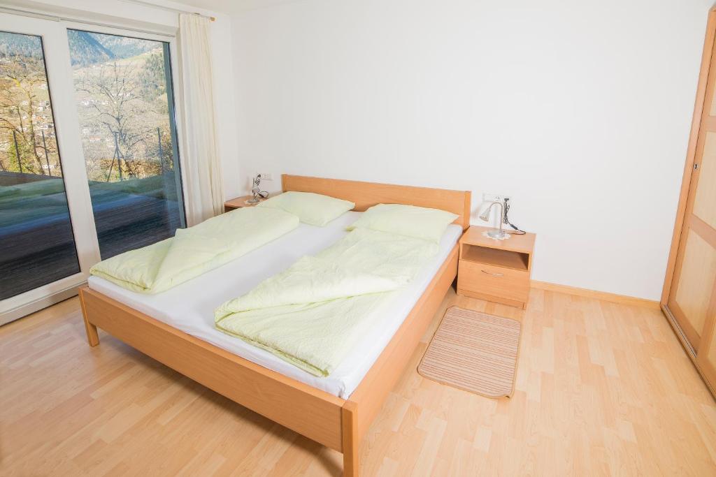 Łóżko lub łóżka w pokoju w obiekcie Residence Fiegl