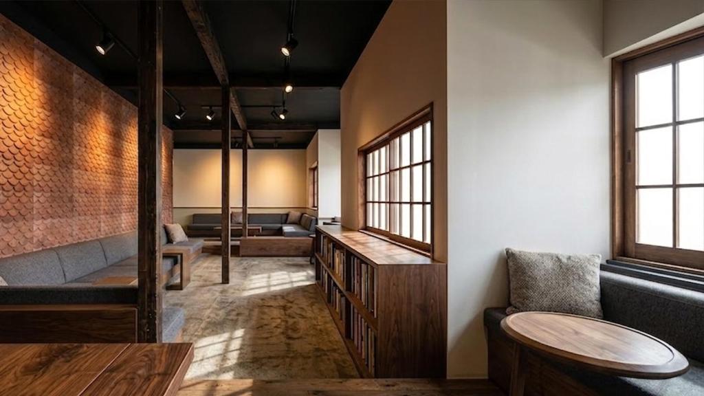 a living room with a couch and a table at Ruhe K in Kusatsu