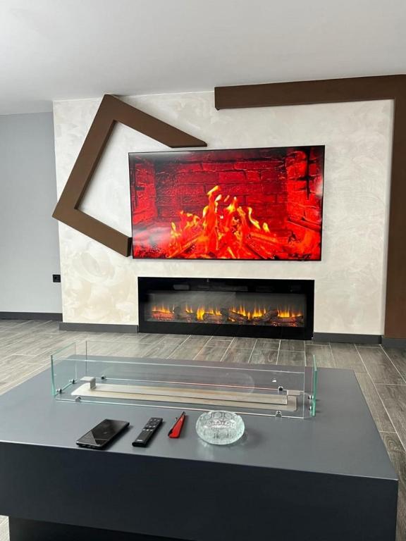 a fireplace in a living room with a fire place at Kent Suites Hotels Ataşehir in Istanbul