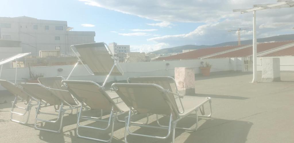 a group of chairs sitting on a roof at O&M Port Piraeus in Piraeus