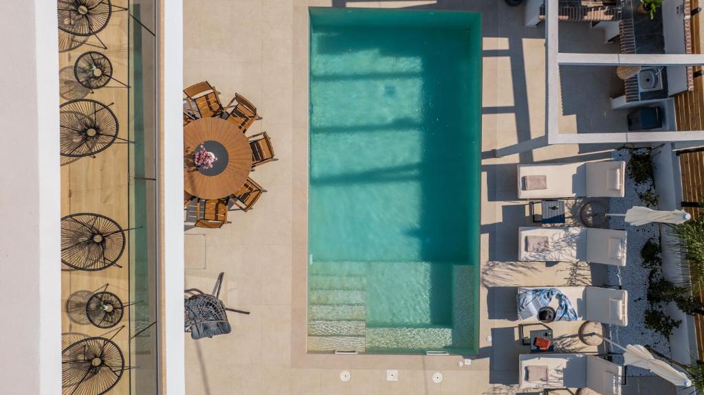 an overhead view of a swimming pool at a resort at Villa Lux Stana in Zakynthos