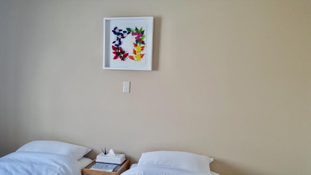 Postel nebo postele na pokoji v ubytování Uchimaru Hakuba