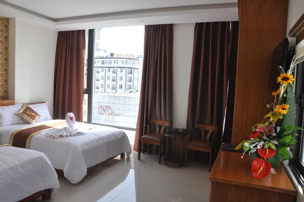 Postel nebo postele na pokoji v ubytování Charming Danang Hotel-203 Nguyễn Văn Thoại