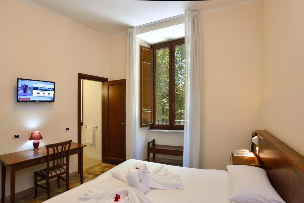 Postel nebo postele na pokoji v ubytování Casa I Cappuccini