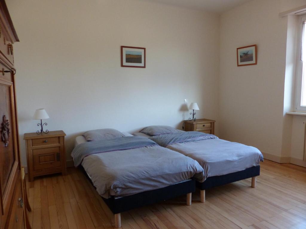 Postel nebo postele na pokoji v ubytování Gîte du moulin