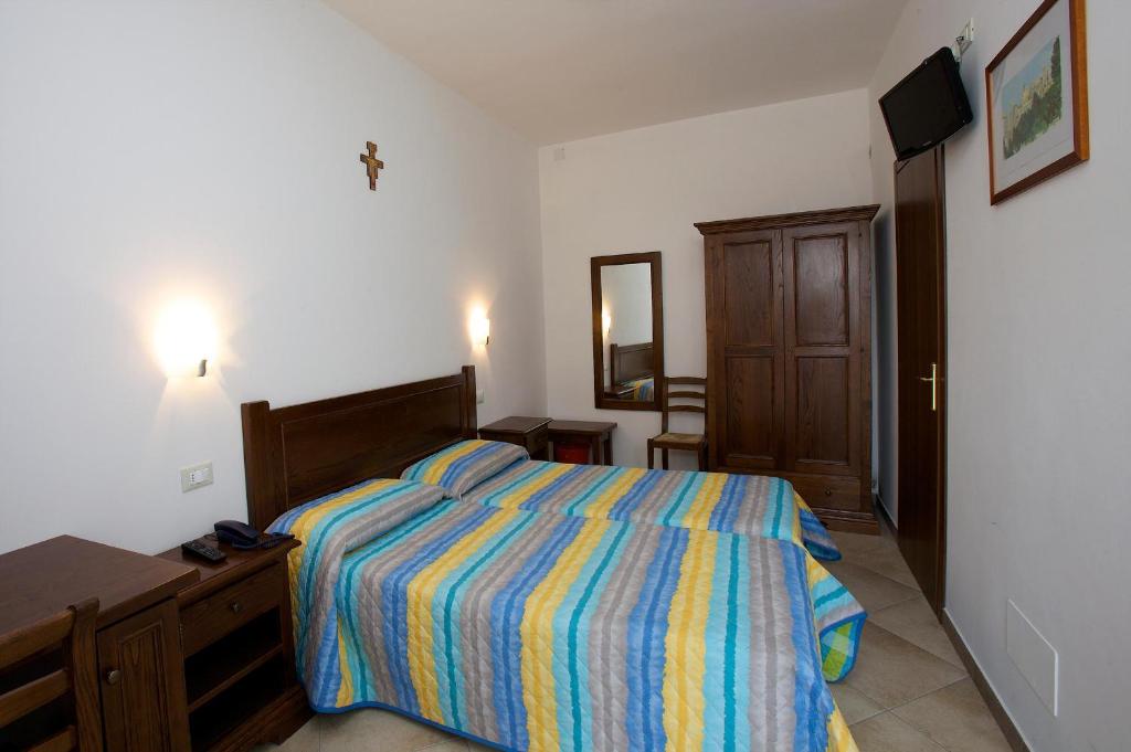 Łóżko lub łóżka w pokoju w obiekcie Hotel Da Angelo