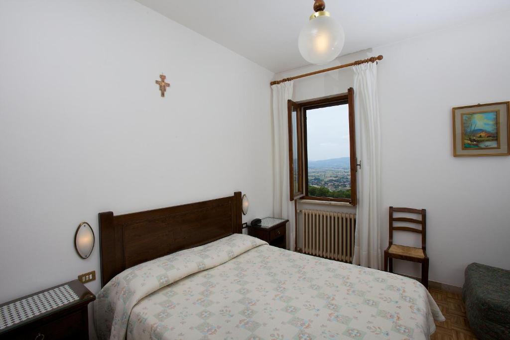 Łóżko lub łóżka w pokoju w obiekcie Hotel Da Angelo