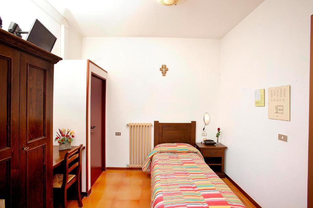 Łóżko lub łóżka w pokoju w obiekcie Hotel Da Angelo