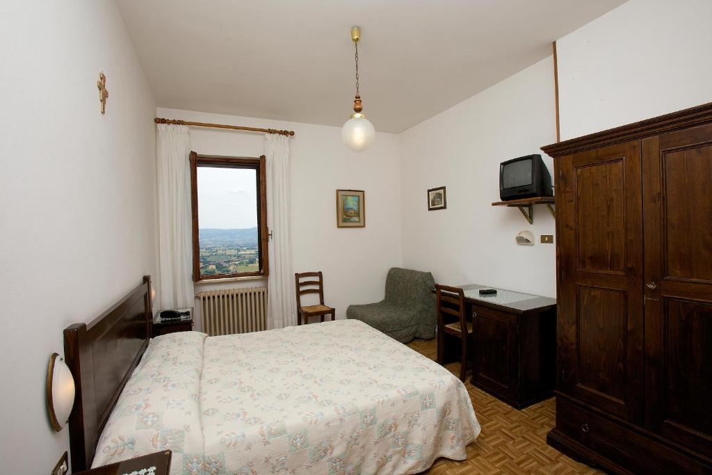 Łóżko lub łóżka w pokoju w obiekcie Hotel Da Angelo