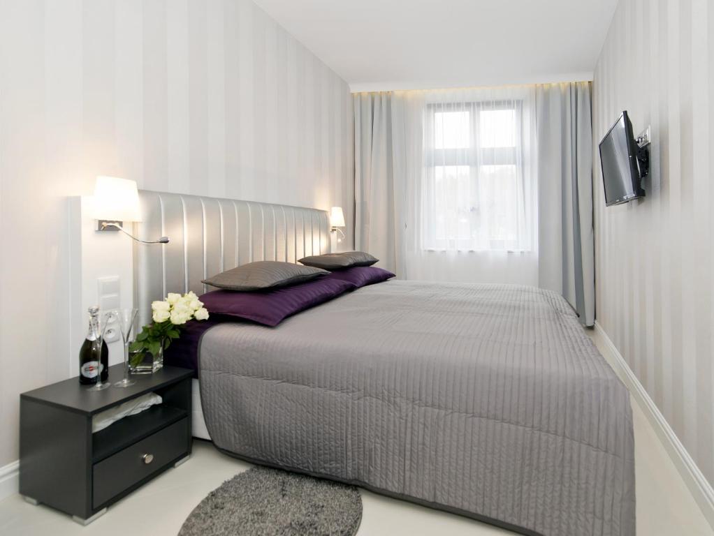 Posteľ alebo postele v izbe v ubytovaní Softly Residence