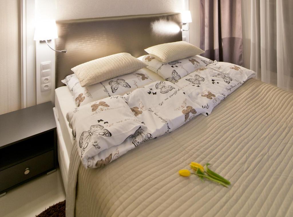 Posteľ alebo postele v izbe v ubytovaní Softly Residence